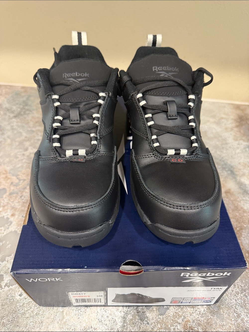 Reebok Black Work Sneakers with White Lace Highlights